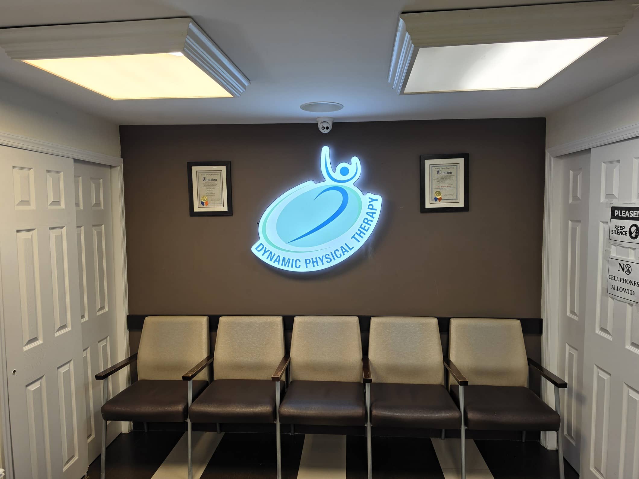 Glen Oaks clinic waiting room with the Dynamic Physical Therapy branded sign